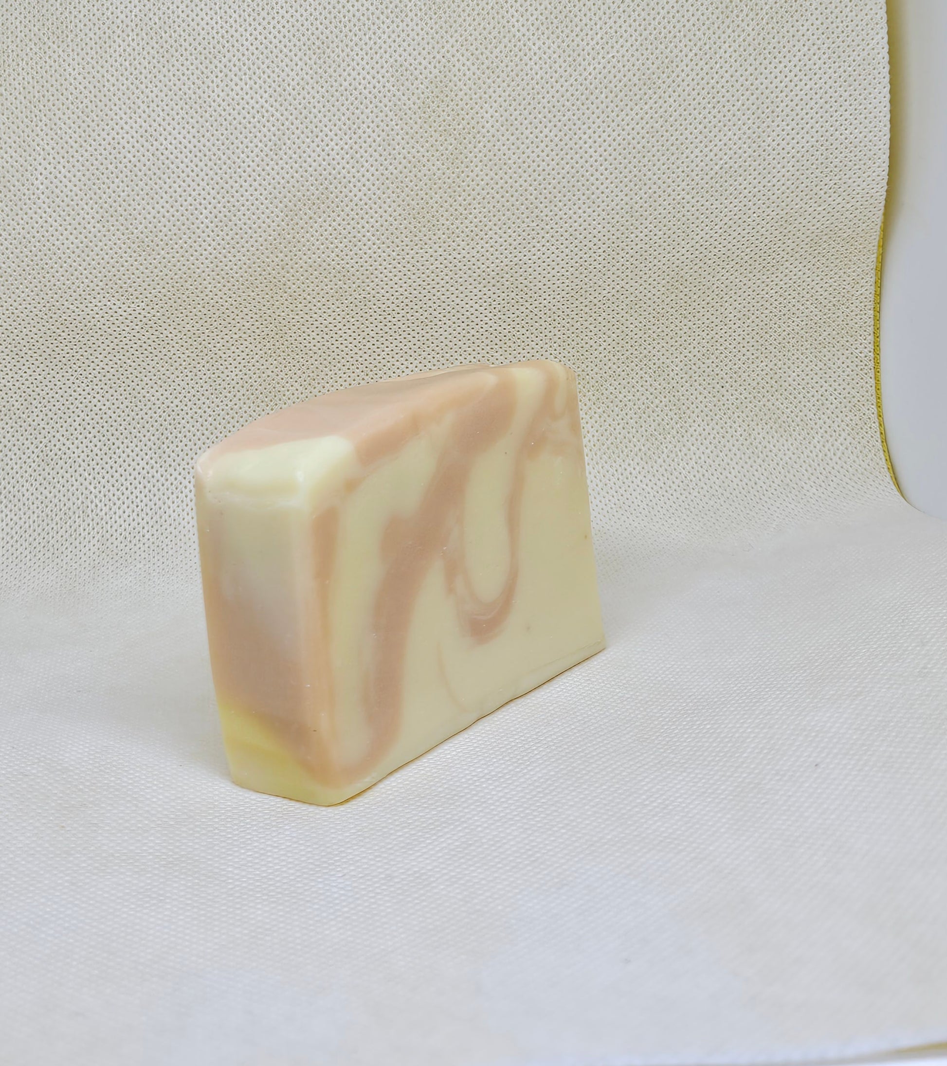 Bar of soap with a marbled pattern on a white background